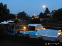 Fotografías del jardín, de la piscina, del porche, la barbacoa y la pista de petanca de Cal Sabater d'Ordis